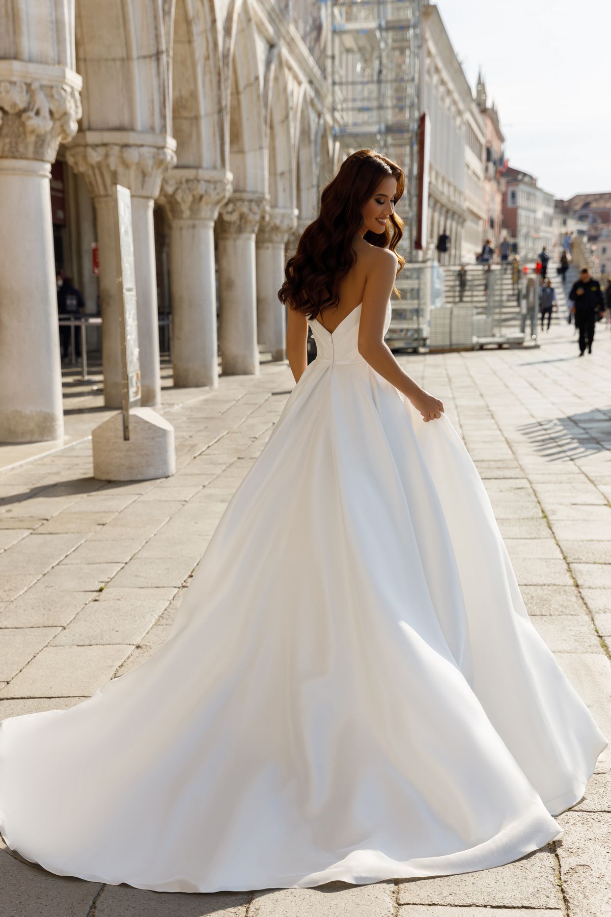 Satin Princess silhouette Victoria wedding dress by Oksana Mukha with a slit on the left side at Dell'Amore Bridal, Auckland, NZ. 6