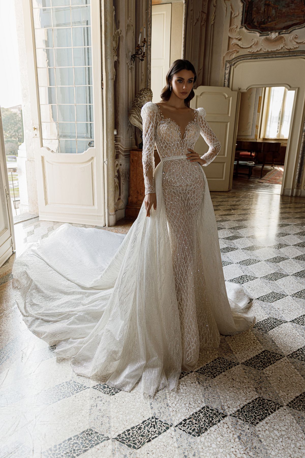 Fitted silhouette lace Maya wedding dress by Oksana Mukha embroidered with Swarovski crystals, long sleeves and detachable overskirt at Dell'Amore Bridal, Auckland, NZ 12