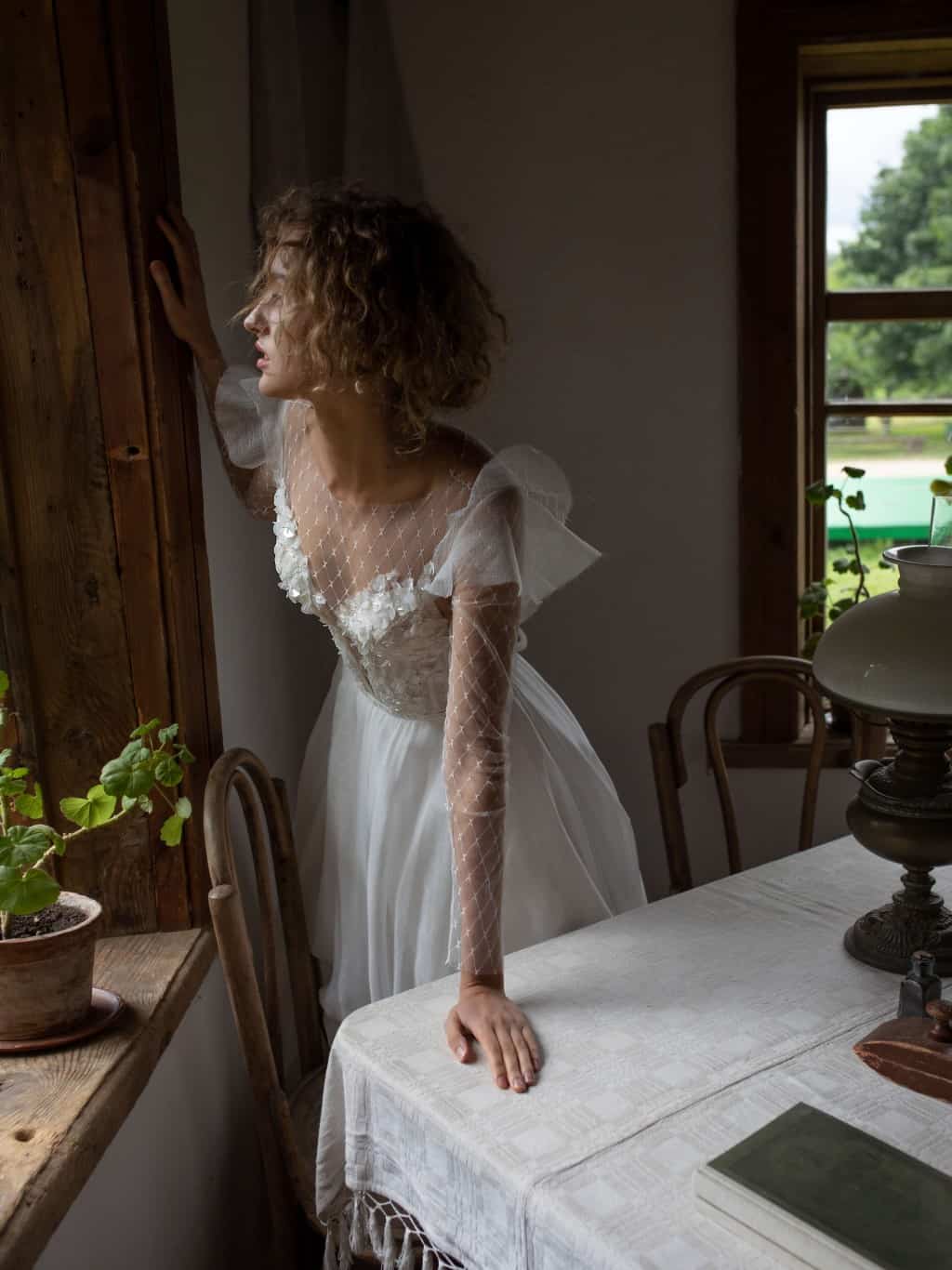 A line lace tulle wedding dress Melentia with long sleeves by Rara Avis at Dell' Amore Bridal, Auckland, NZ. 2