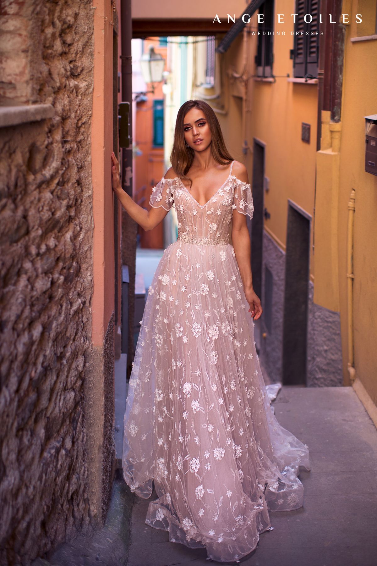 Floral bridal dress Tania by Ange Etoiles; It has off-shoulders sleeves, beaded belt and a soft A-line skirt. 3