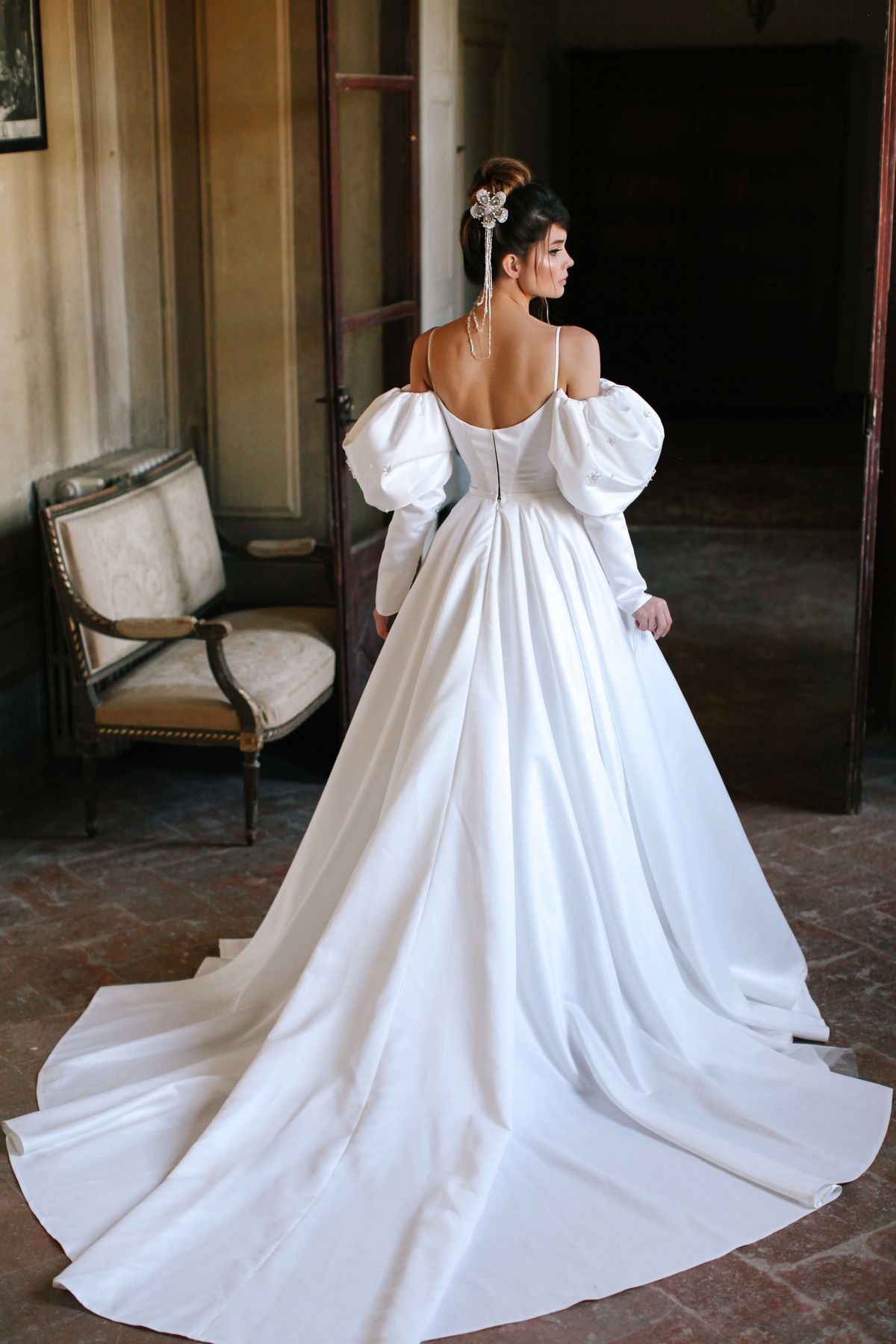 Itan wedding dress by rara avis with white satin fabric and off shoulders long sleeves at Dell'Amore Bridal, Auckland, NZ. 7