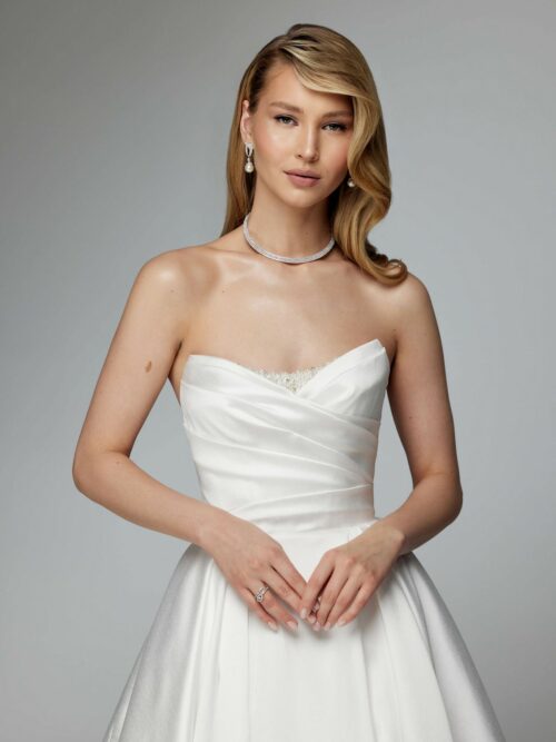 Simple elegant wedding dress with a long train and removable sleeves by ang etoiles. 1