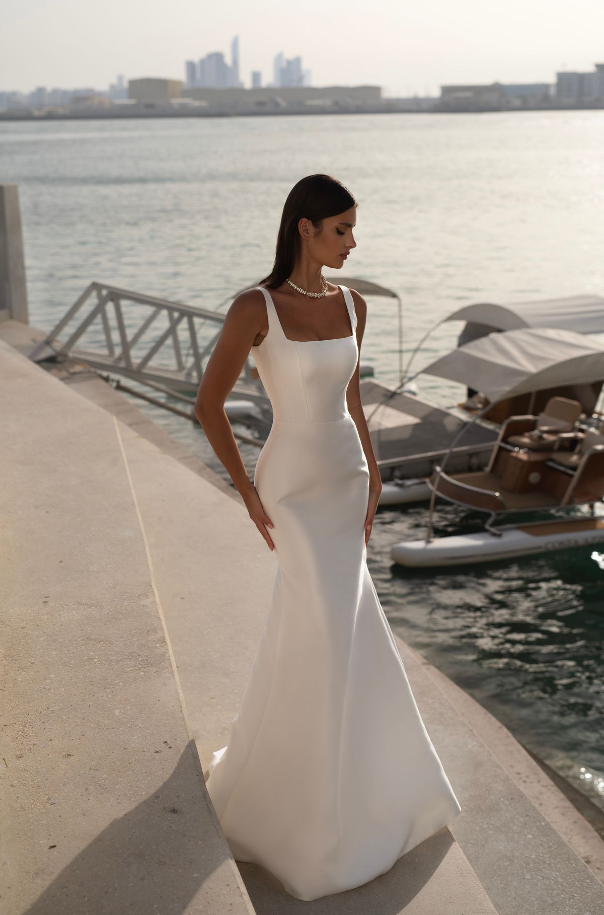 Satin wedding dress Farzet with square neckline by Romanova at Dell'Amore Bridal, Auckland, NZ. 1