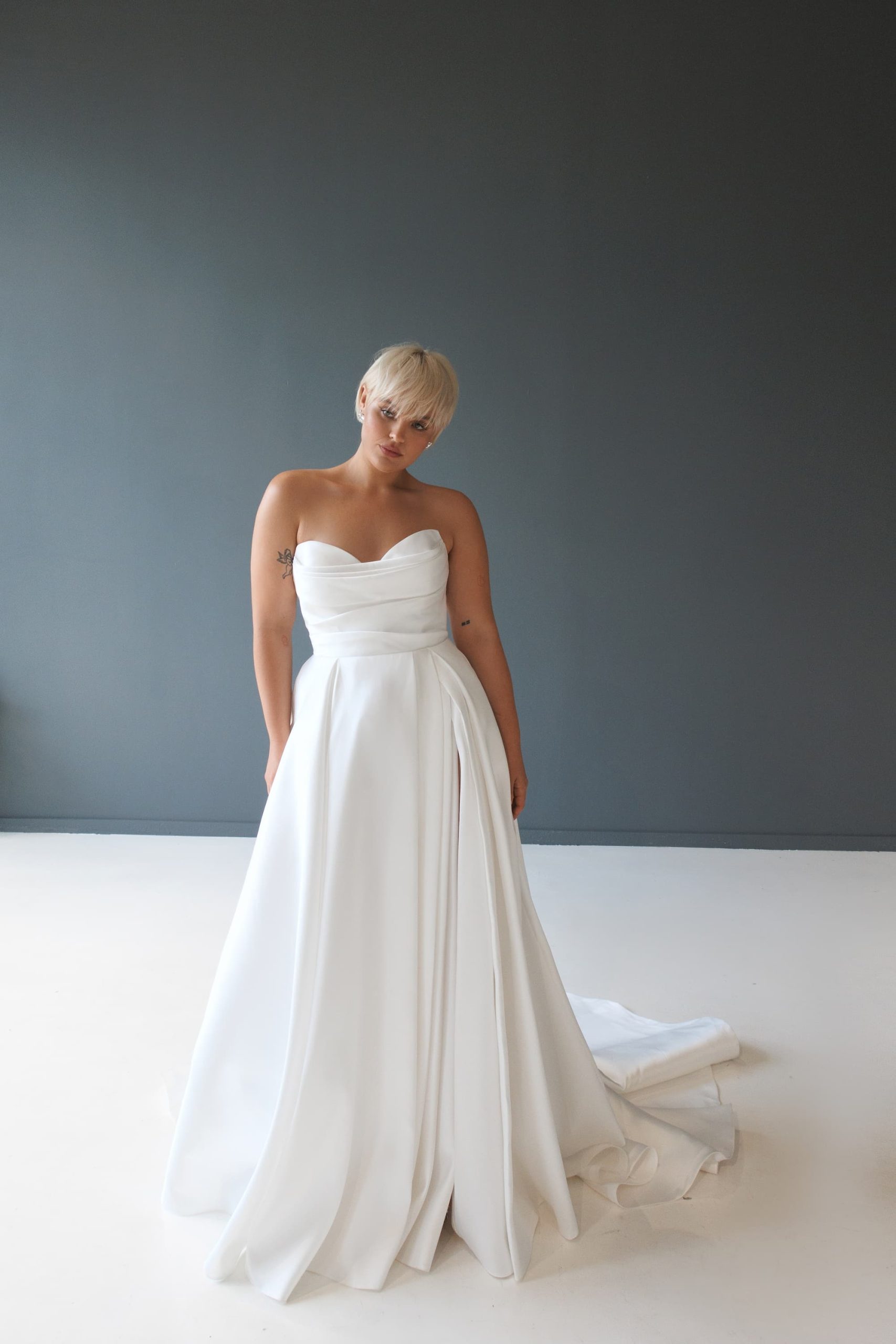 Satin wedding dress Barbel plus size with open shoulders and a slit skirt by Patricia Couture at Dell'Amore Bridal, Auckland, NZ 9