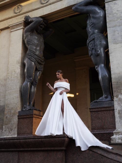 Satin wedding dress Barbel with open shoulders and a slit skirt by Patricia Couture at Dell'Amore Bridal, Auckland, NZ 1