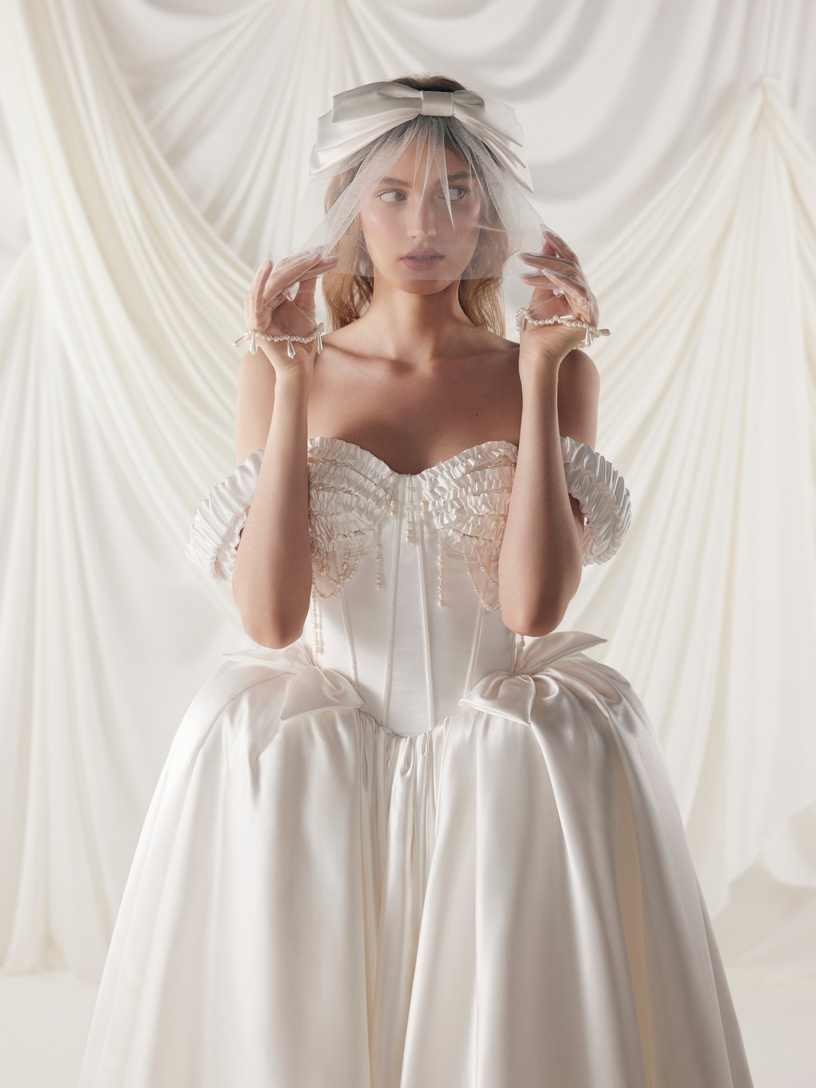 Princess off-shoulder wedding dress Sharlotta made from pearl satin by rara avis at Dell'Amore Bridal, NZ. 2