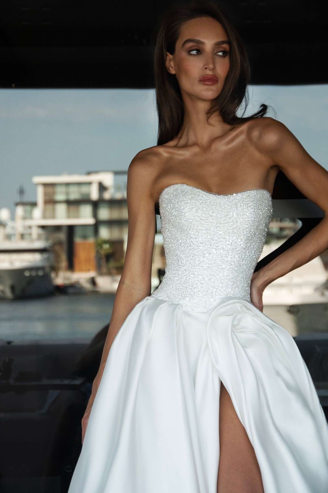 Flower draping wedding dress Harris with glittery corset and slit in the skirt by patricia coutureat Dell'Amore Bridal, NZ. 1